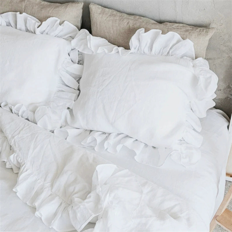 White Rustic Linen Pillowcases with Frills - Set of 2 on a bed