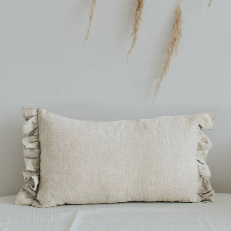 Elegant natural linen pillow case with frills, soft texture, home decor accent.