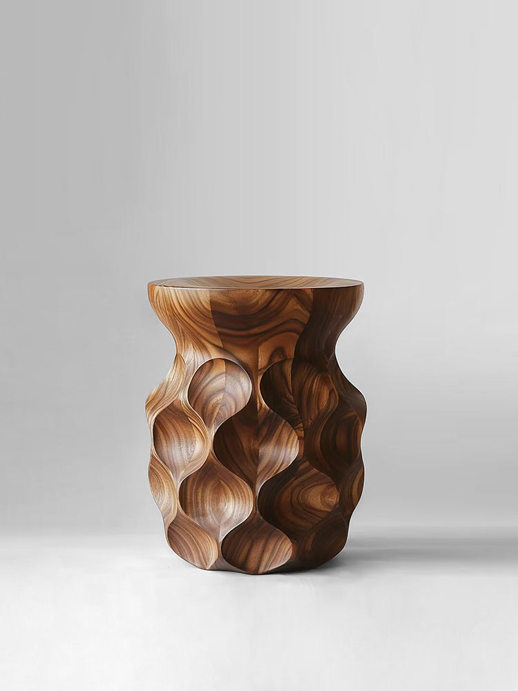 Sculptural walnut wood stool with wavy texture, modern statement piece.