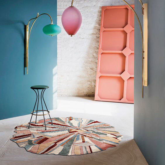 Unique Abstract Rug in blues, pinks, and creams, styled in a modern living room.