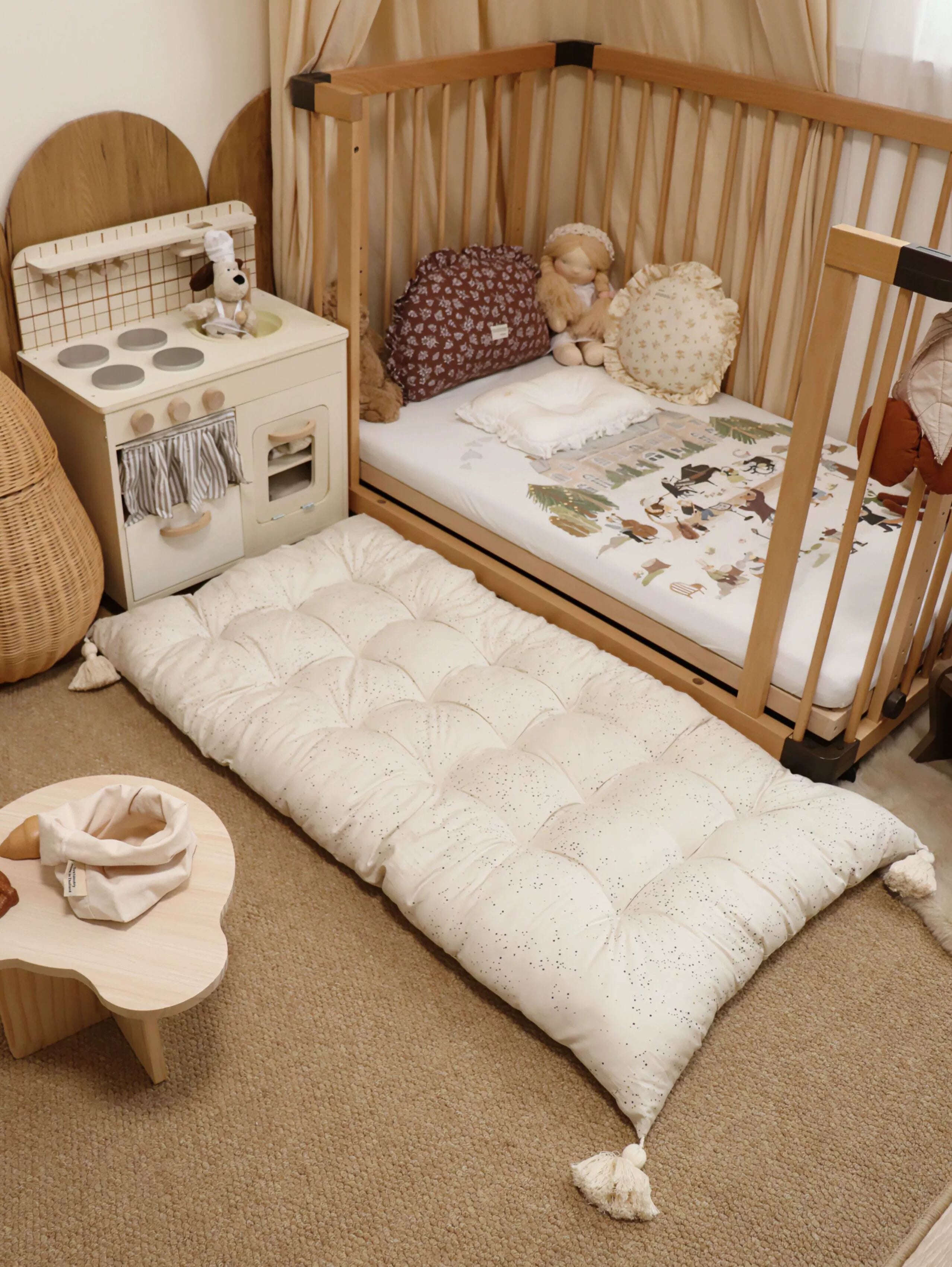 Beige dotted floor cushion with tassels for kids' room, mat, floor seating.