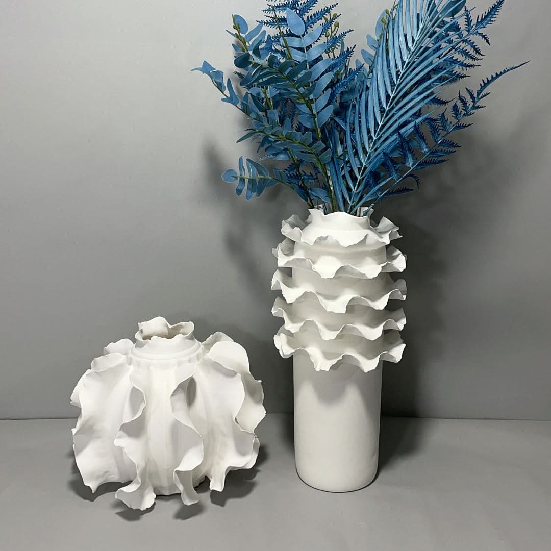 Modern handmade lace ceramic flower vase, elegant white ruffled decor with blue branches.