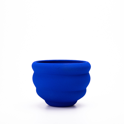 Klein Blue Flower Vase: handcrafted ceramic vase with textured blue finish on white background.