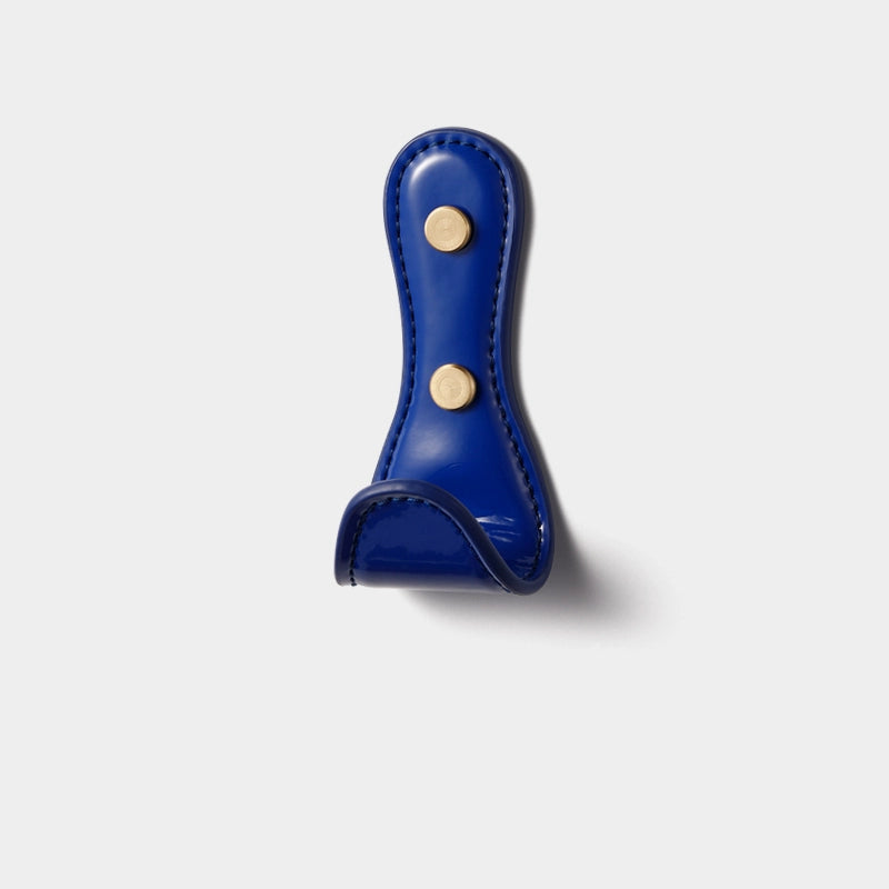 Vibrant blue leather wall hook with gold hardware, part of Dopamine Decor Colors collection.
