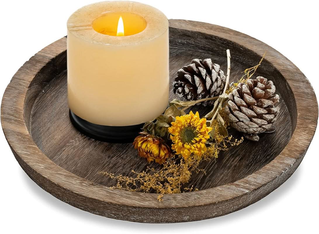 Rustic wooden tray decorative with candle, pinecones, and dried flowers.
