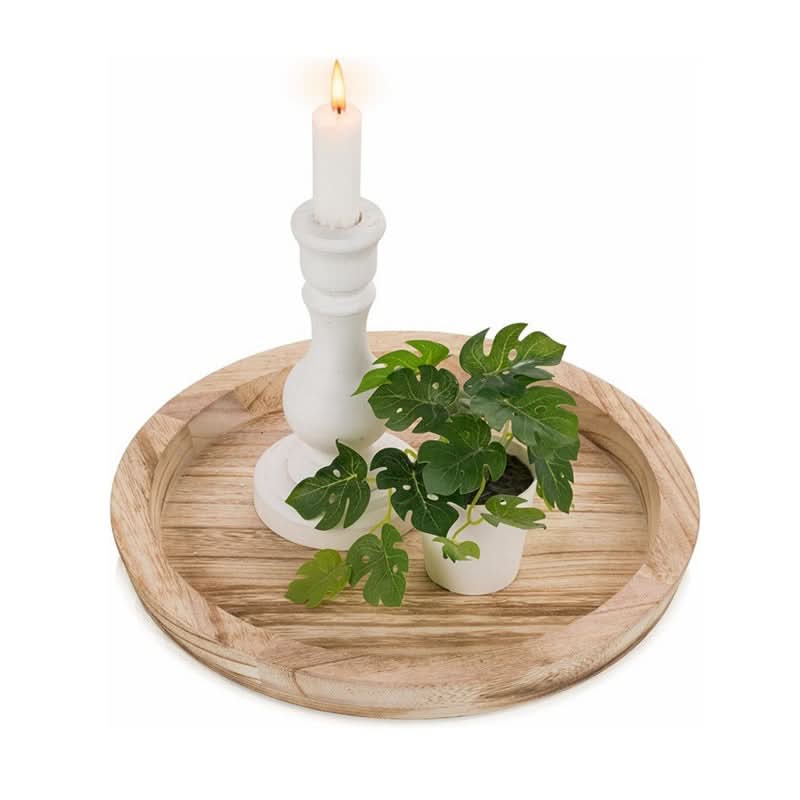 Natural wood decorative tray with white candle holder and green plant
