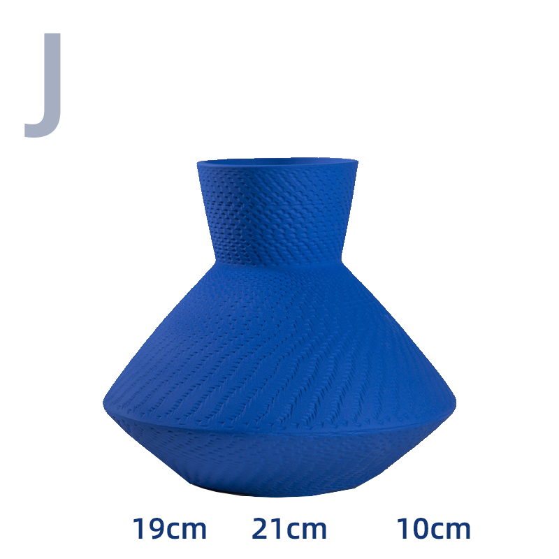 Vibrant blue textured vase with woven pattern, ceramic home decor.