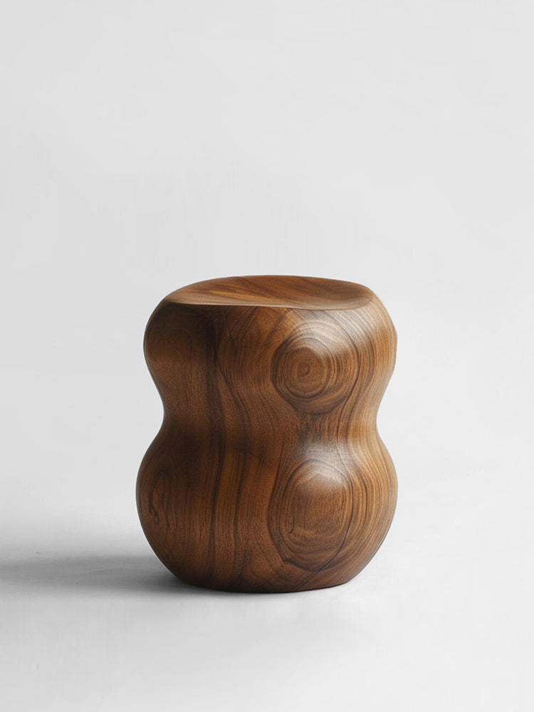 Hand-carved walnut wood pumpkin stool, a unique home decor piece.