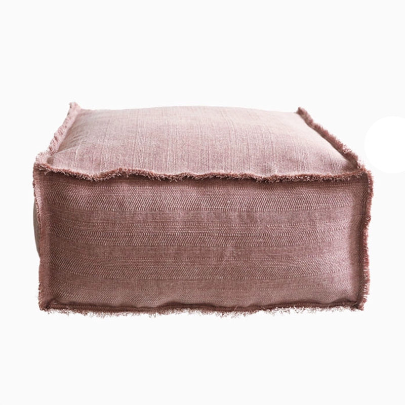 Rustic Square Fabric Ottoman in warm taupe, textured fabric with frayed edges.