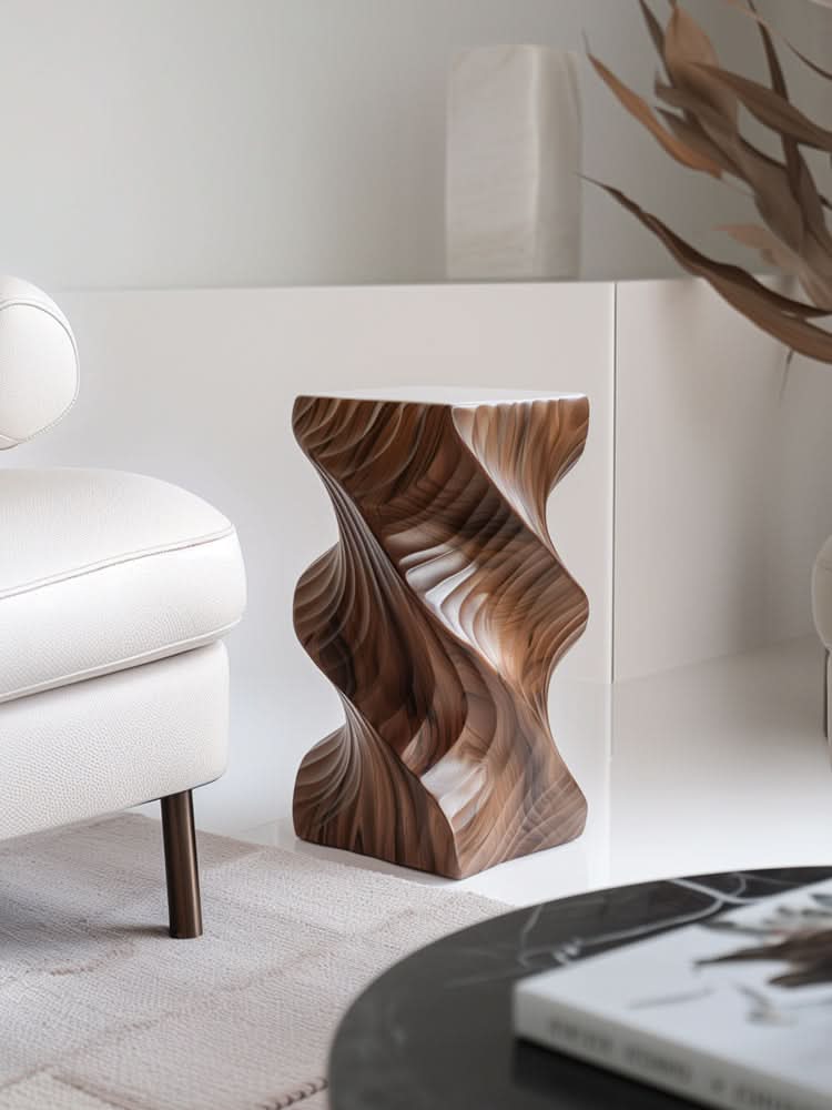 Abstract wood side table with modern art accent, showcasing carved walnut-toned wood in a contemporary living room setting.
