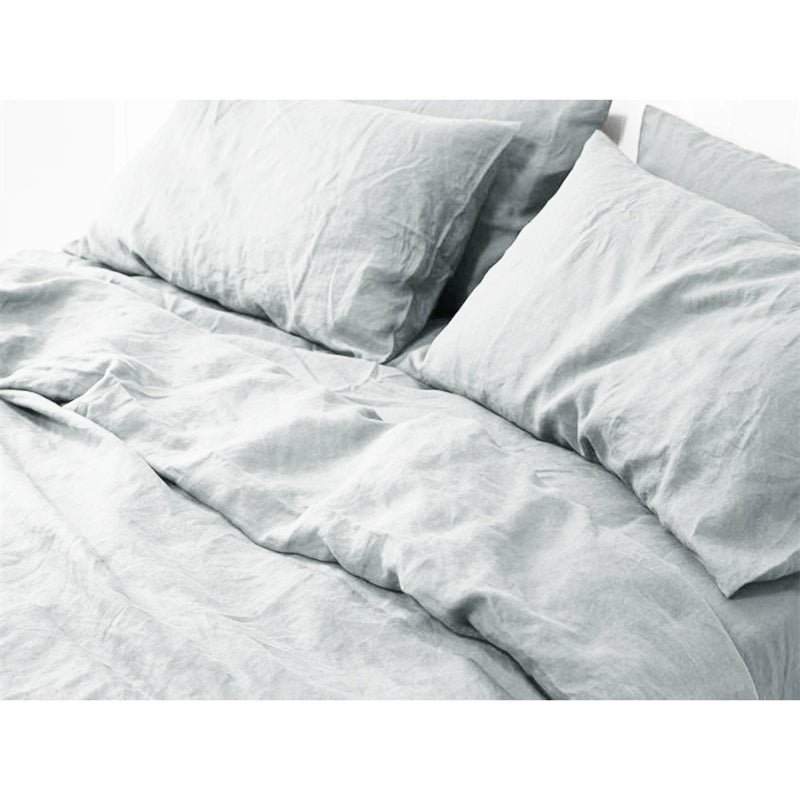 Light blue Natural Linen Bedding Set with soft, comfortable texture on a bed.