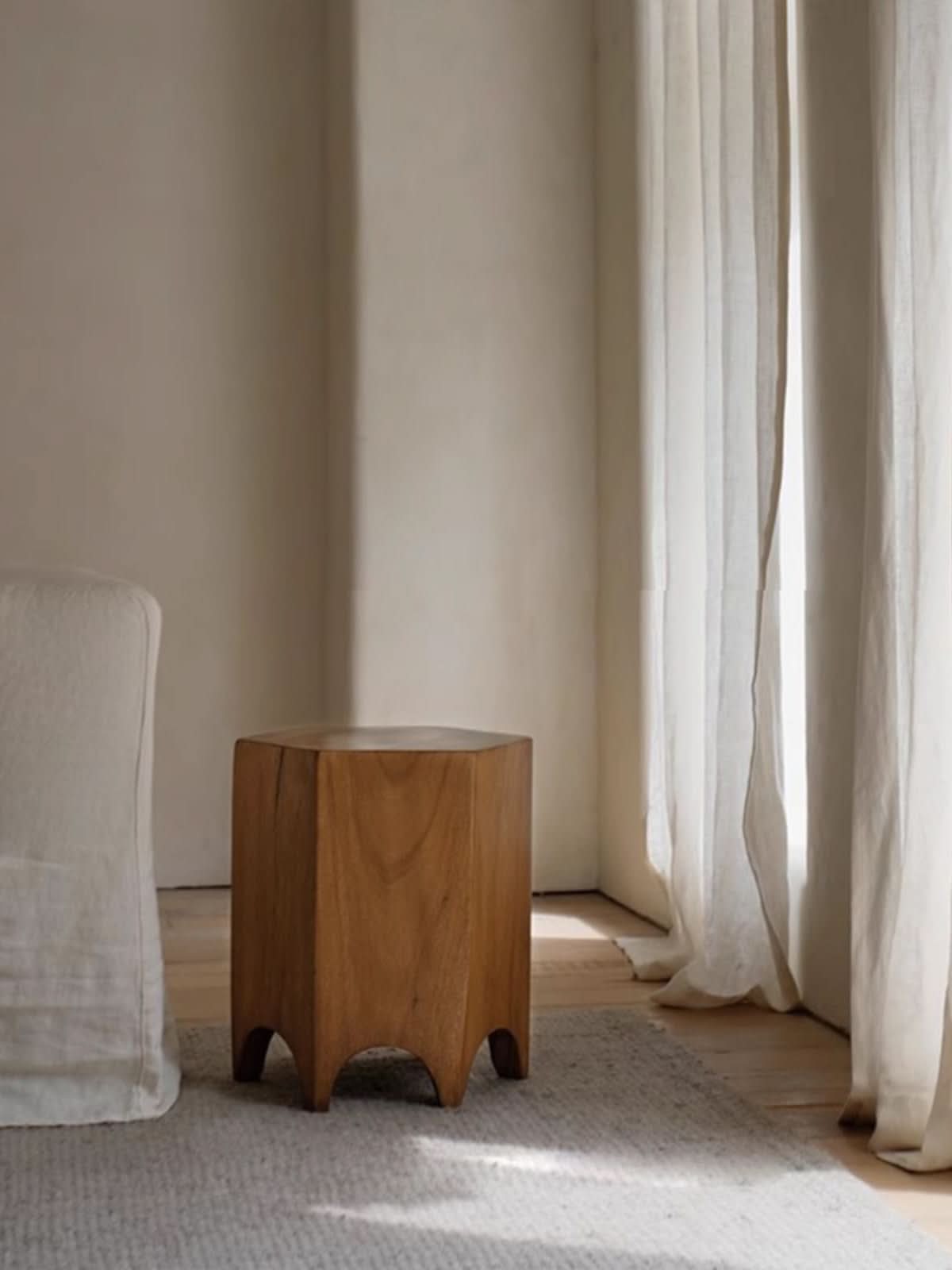Minimalist Hexagonal Side Table - Natural wood accent piece next to white furniture and linen curtains.