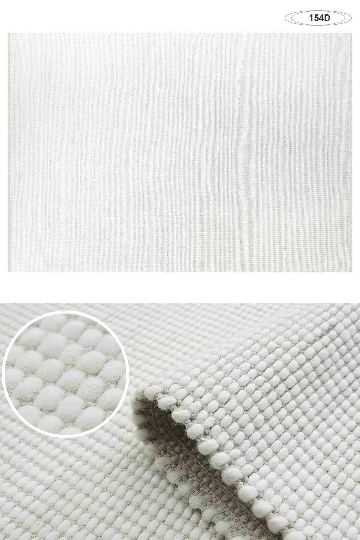 Wool Handwoven Cream Rug with detailed texture, a neutral home decor accent.