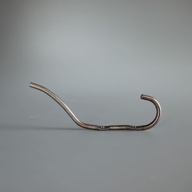 Metal industrial style wall hook with a rustic finish, on a gray background.