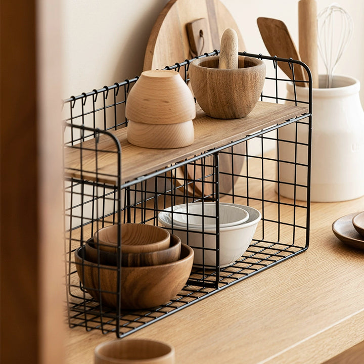 Black metal wire wall shelf with wooden top, double tiered.  Storage organizer with wooden bowls.