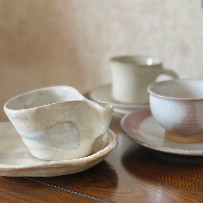 Hand-thrown Japanese vintage teacup and saucer set in cream with blue accents, home decor ceramic.