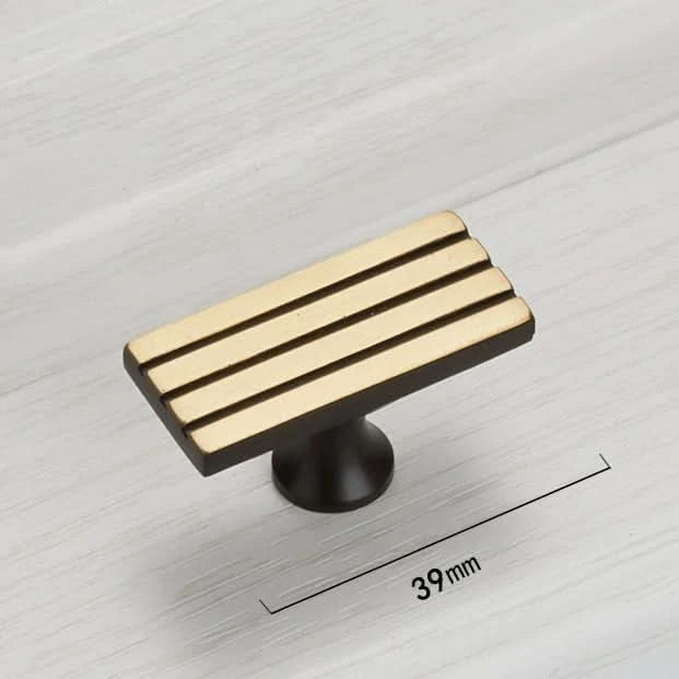Modern Geometric Cabinet Handle in gold & black copper on wood grain surface, 39mm.