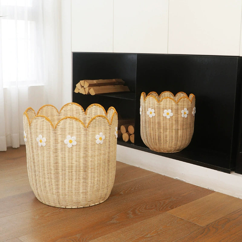 Beige rattan storage basket with scalloped edge & yellow daisy embroidery.  Durable, decorative.