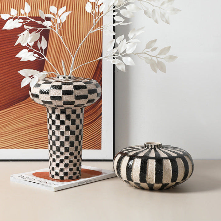 Hand-painted Wabi-Sabi retro ceramic flower vase in black and white checkerboard design with dried flowers.