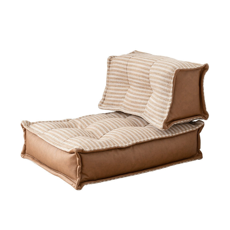 Modern Minimalist Floor Sofa: brown vegan leather, striped fabric cushions, comfortable seating.