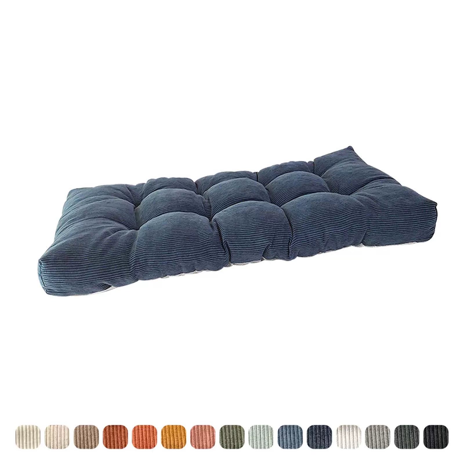 Dark blue corduroy bench cushion, side view highlighting the loft and tufted structure.