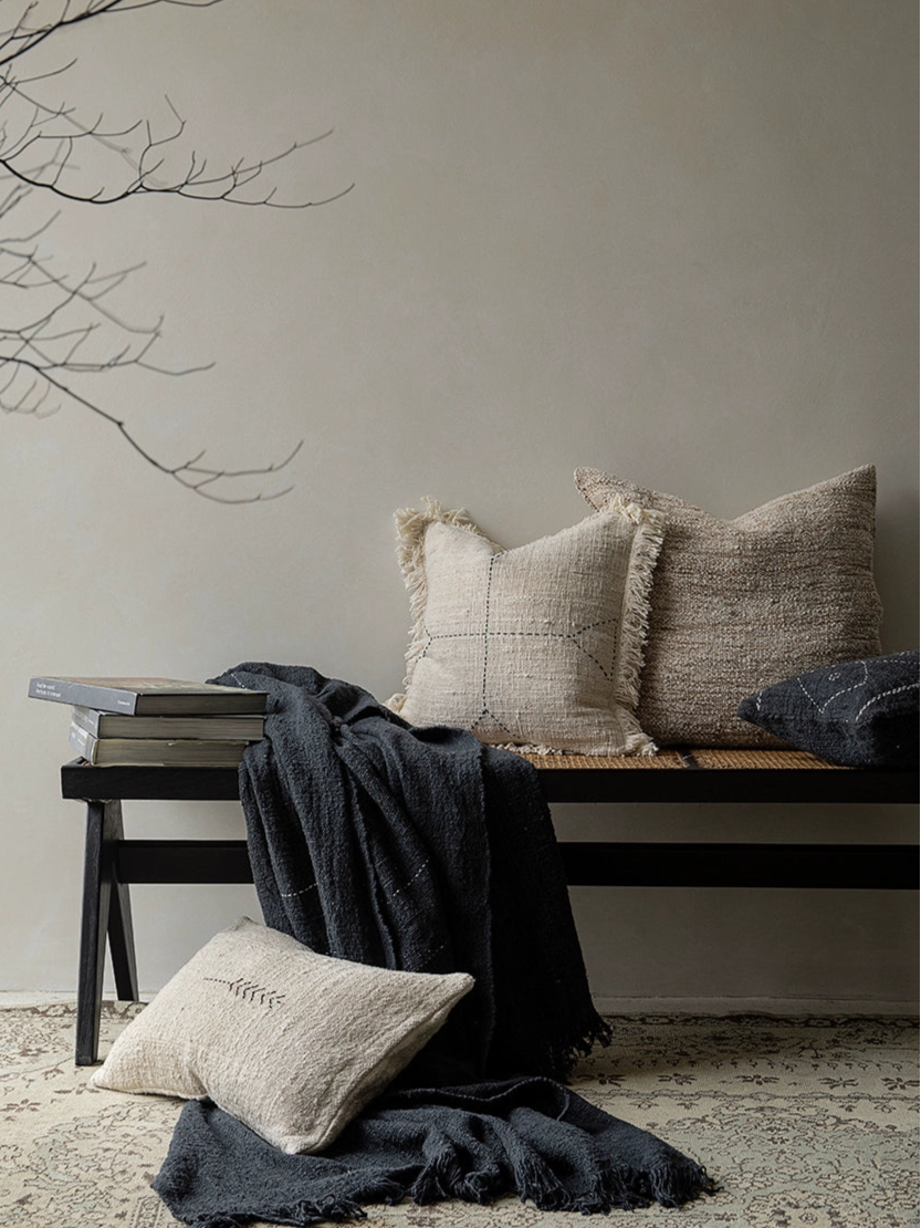 Boho Throw Pillows & Blanket Set: beige, black, natural woven cushions styled on a bench with a dark throw.