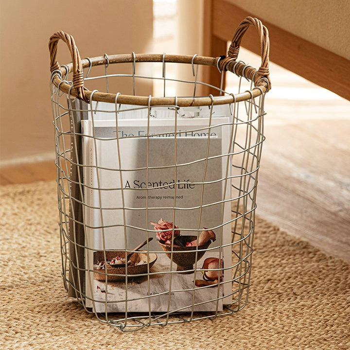 Light gray wire basket with woven handles. Rustic storage and display.
