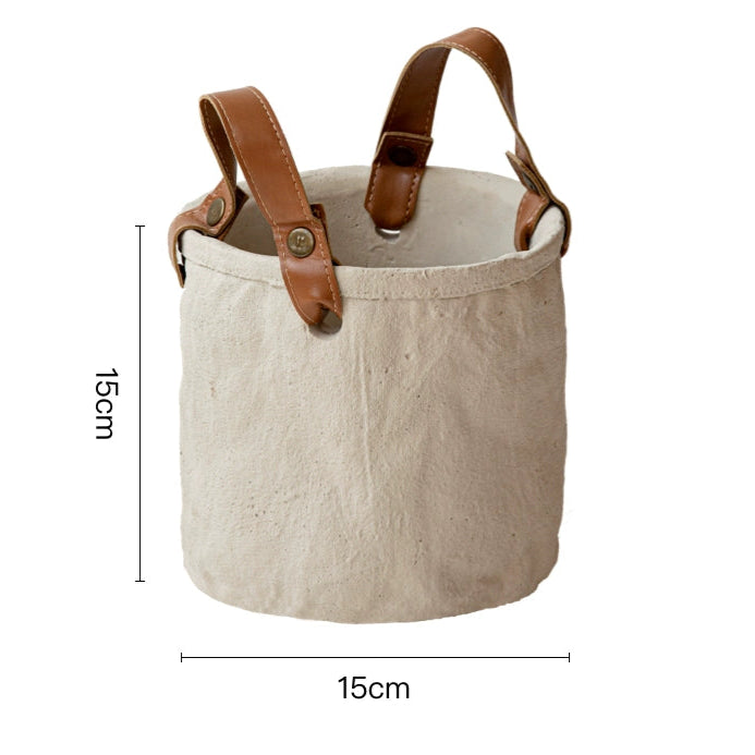 Rustic canvas plant pot with leather handles, home decor.