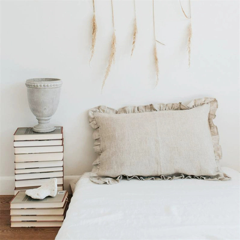 Elegant Linen Pillow Cases with Frills in neutral beige on a white bed, home decor