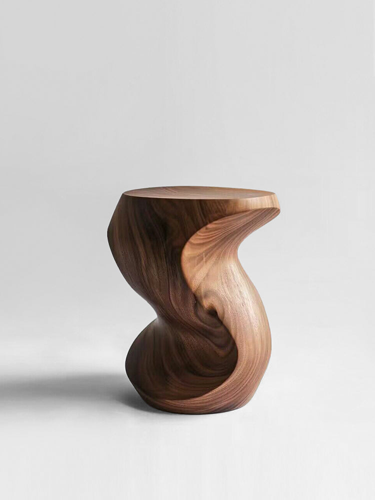 Hand-carved walnut wood pumpkin stool with unique swirling design on a white background.