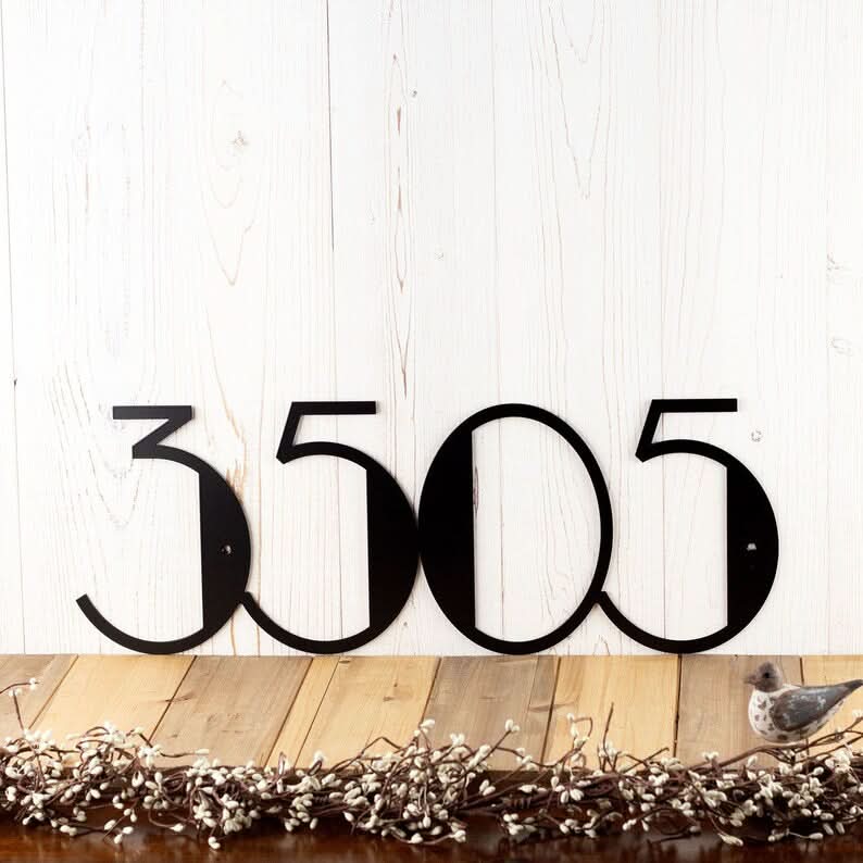 Black Mid Century Address Numbers "3505" mounted on a wood plank wall, with decorative garland.