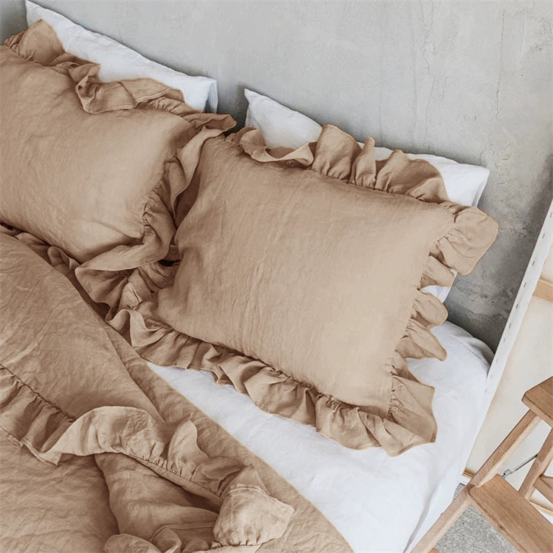 Rustic Linen Pillowcases with Frills - Set of 2 in beige, on a white linen bed.