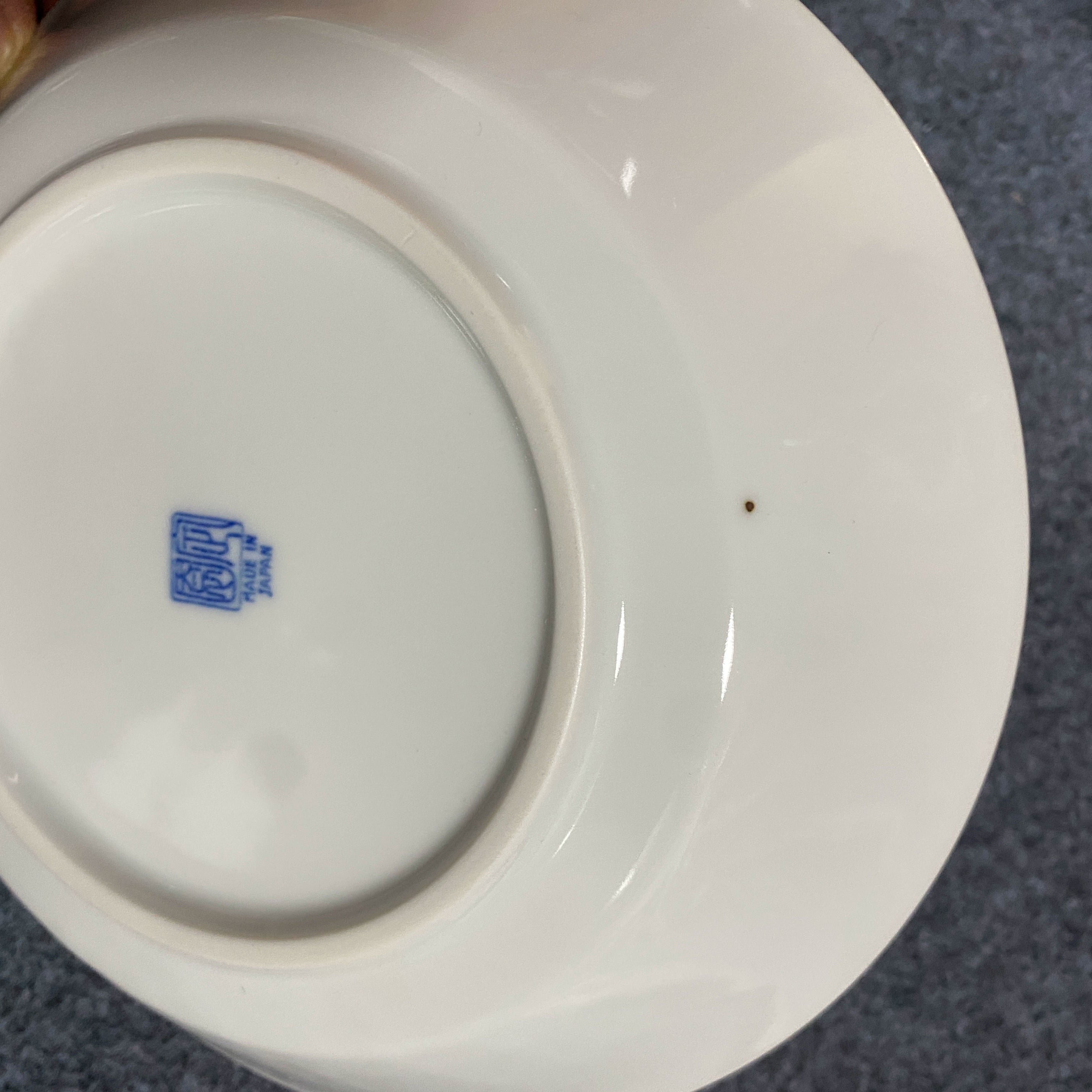 White ceramic plate with blue "Made in Japan" mark. Blue & White Dotted Rim Dinnerware Set.
