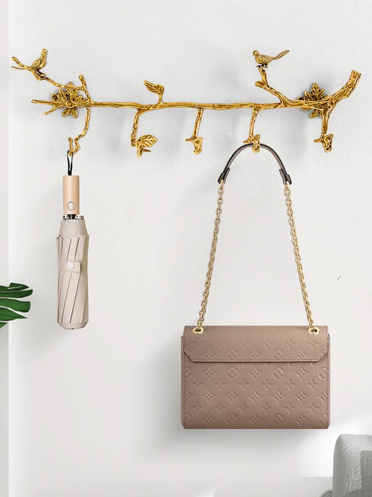 Vintage Brass Bird Branch Wall Hooks, gold metal, holding an umbrella and purse.