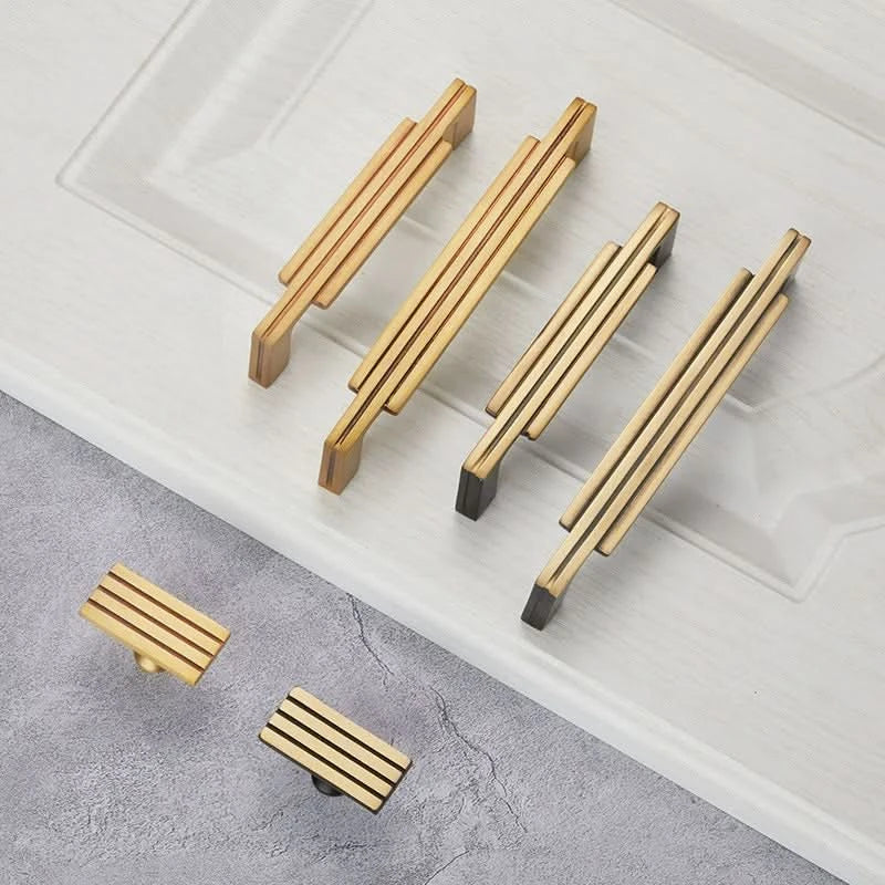 Gold and black geometric cabinet handles, stylish modern home decor hardware.