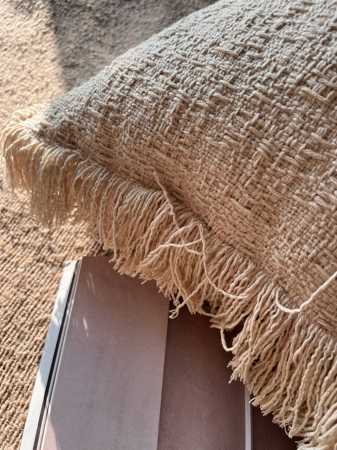 Beige woven throw pillows with fringe detail, part of a set of 2.