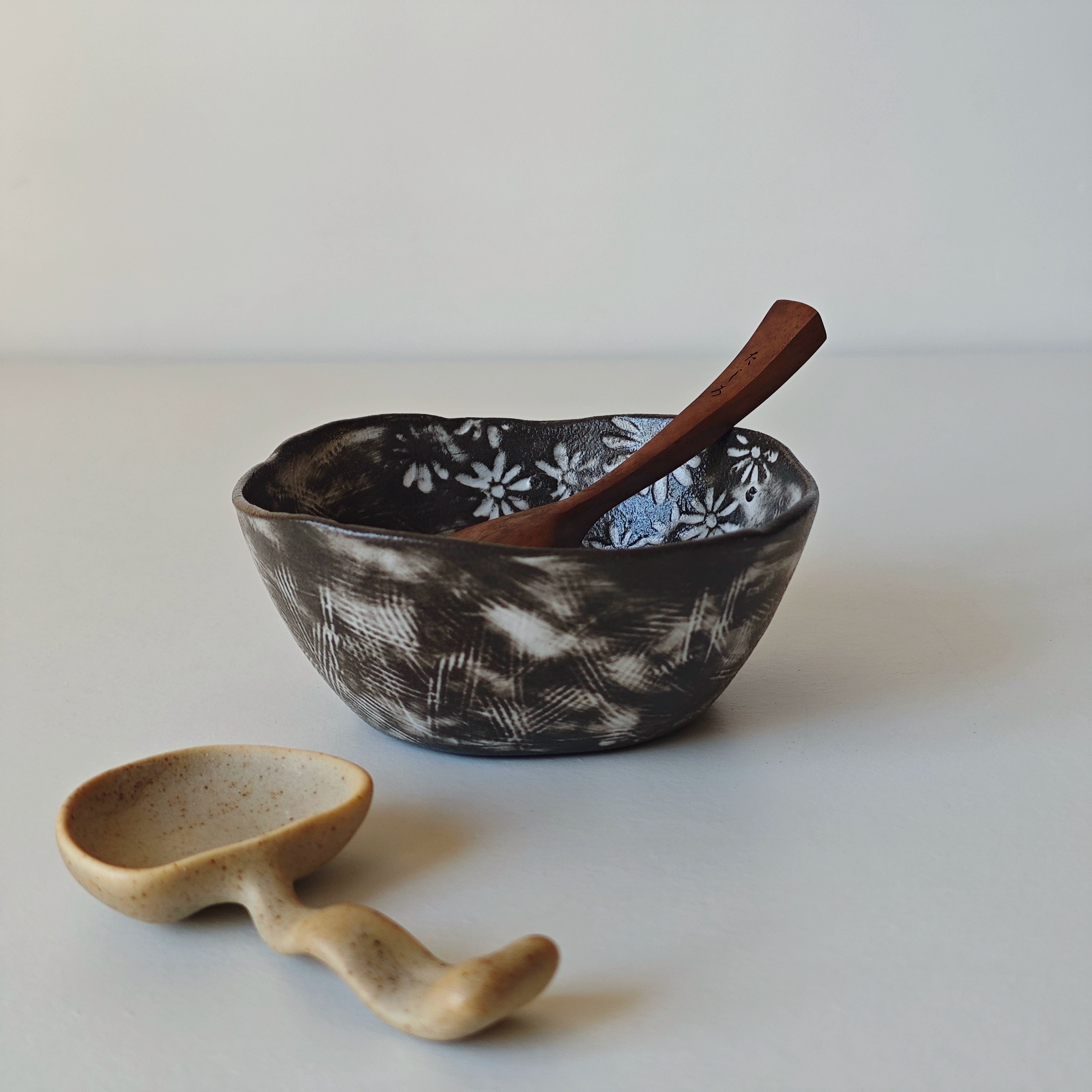 Hand-painted ceramic bowl & spoon set in black/white floral design. Home decor.