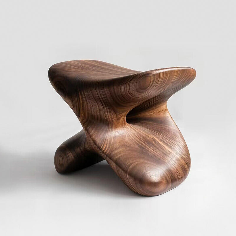 Sculptural Walnut Wood Stool - a modern statement piece with a smooth, natural finish on a white background.