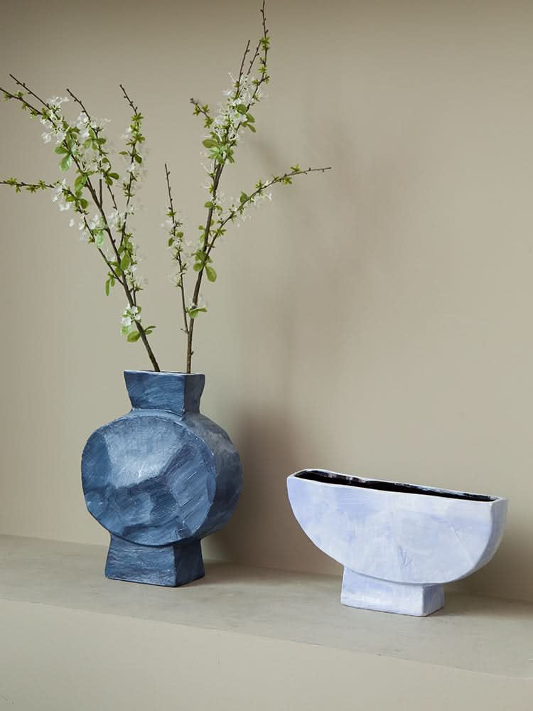 Dreamy Abstract Vase in blue with white branches, next to a lavender bowl planter.