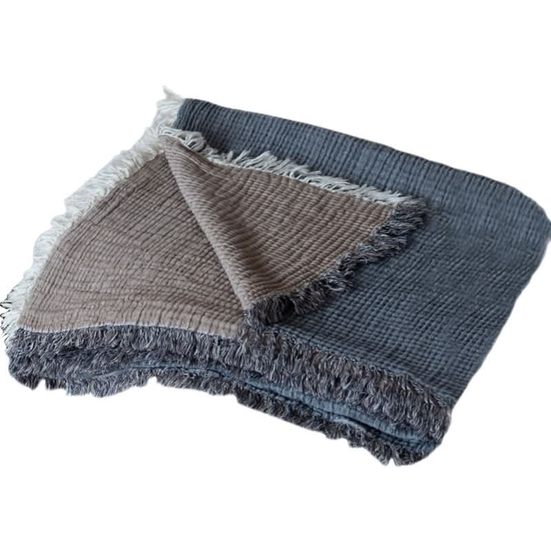 Breathable Cotton Throw Blanket in grey and taupe with fringe details.