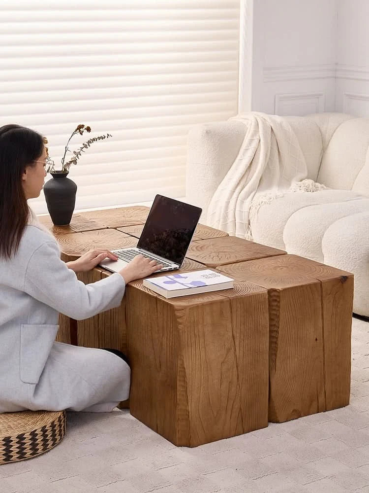 Rustic wooden coffee table, wabi-sabi log cube side table with laptop and book on top.