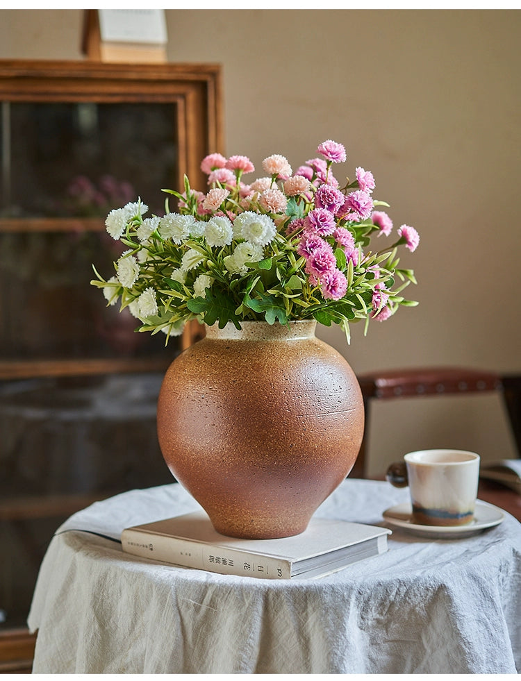 Rustic brown handmade pottery vase, filled with pink and white carnations.  Unique texture and glaze.  Home decor.