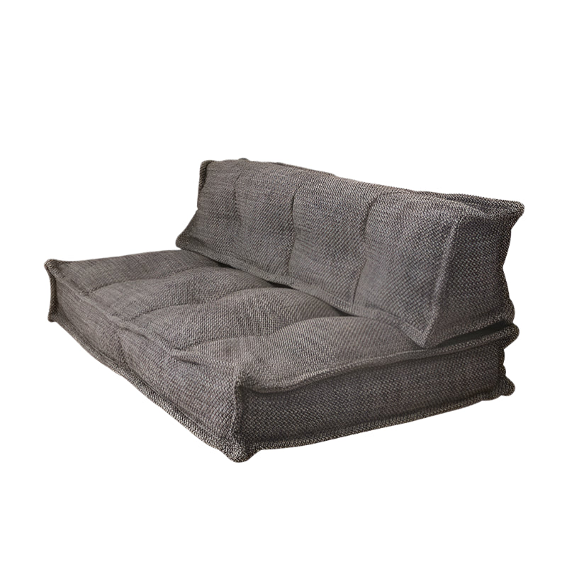 Beige modular sofa, tufted fabric,  comfortable seating.