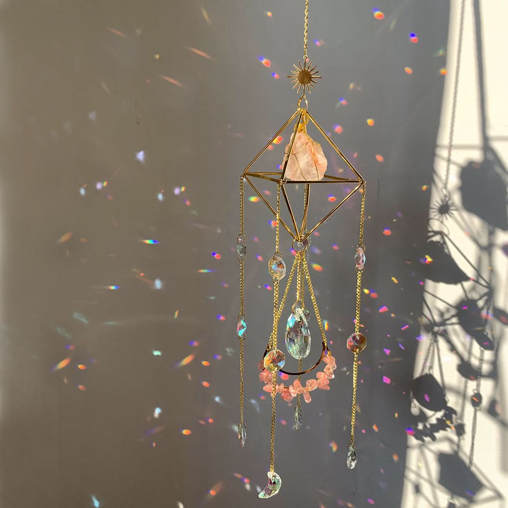 Gold crystal diamond sun catcher with pink stones, moon, and rainbow light refractions.