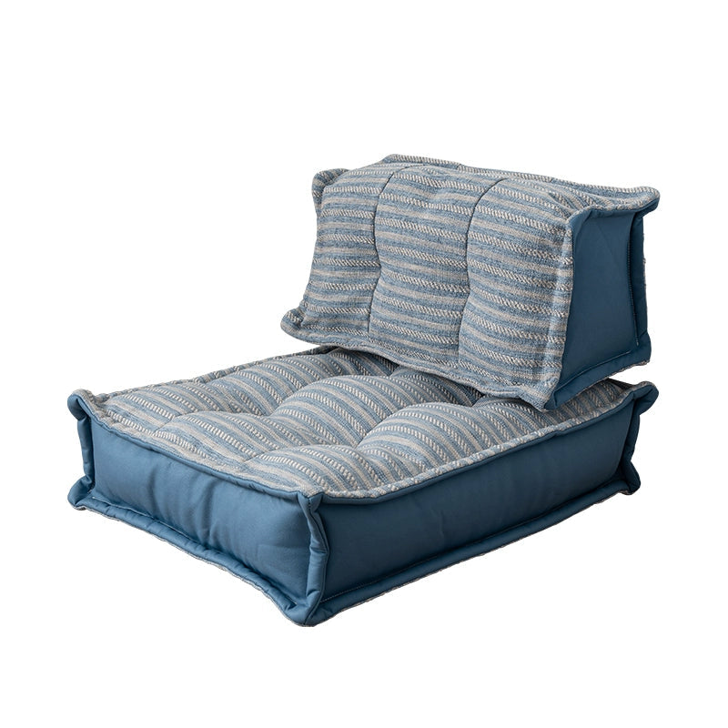 Blue modern minimalist floor sofa with striped fabric upholstery and comfortable seating.