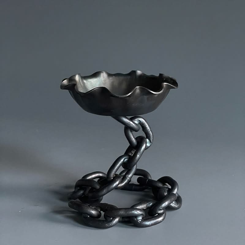 Rustic Candle Holder with Chain Design, dark metal, ruffled edge bowl on chain stand.
