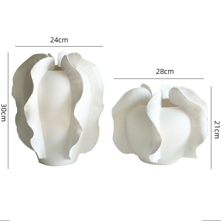 Modern white ruffled ceramic vase set, showcasing artistic, flowing shapes.
