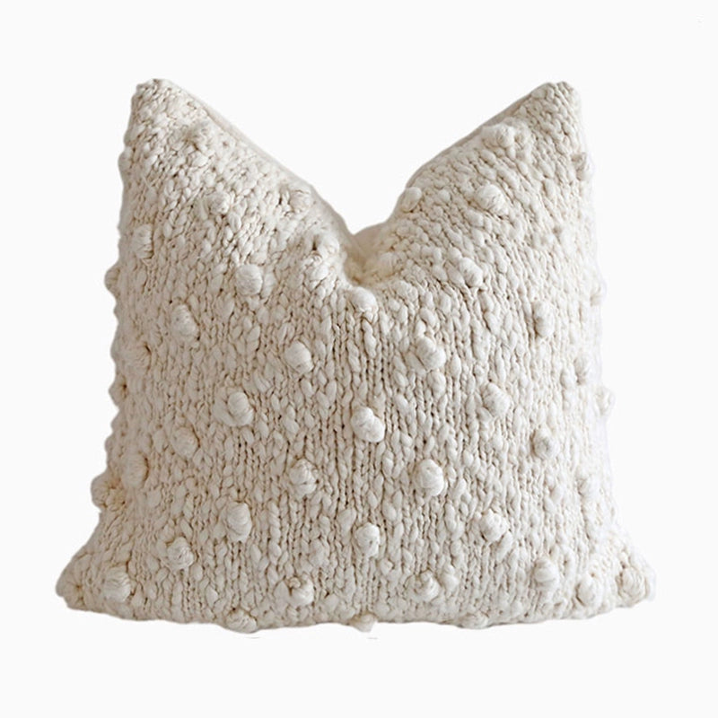 Cream knitted throw pillow with textured bobbles. Set of 4 cozy decor.