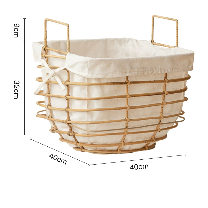 Light beige rattan laundry basket with cream linen liner; square shape, metal handles; home storage.