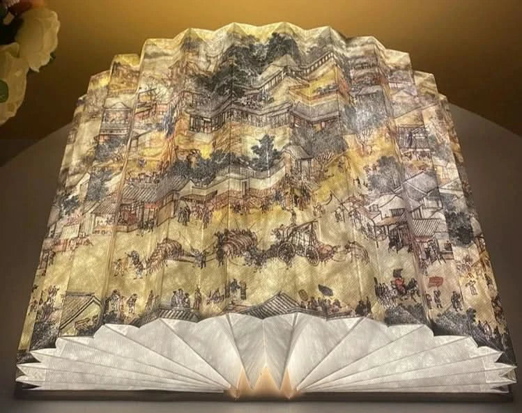 Customizable book paper table lamp with ornate historical scene, gold & sepia tones.